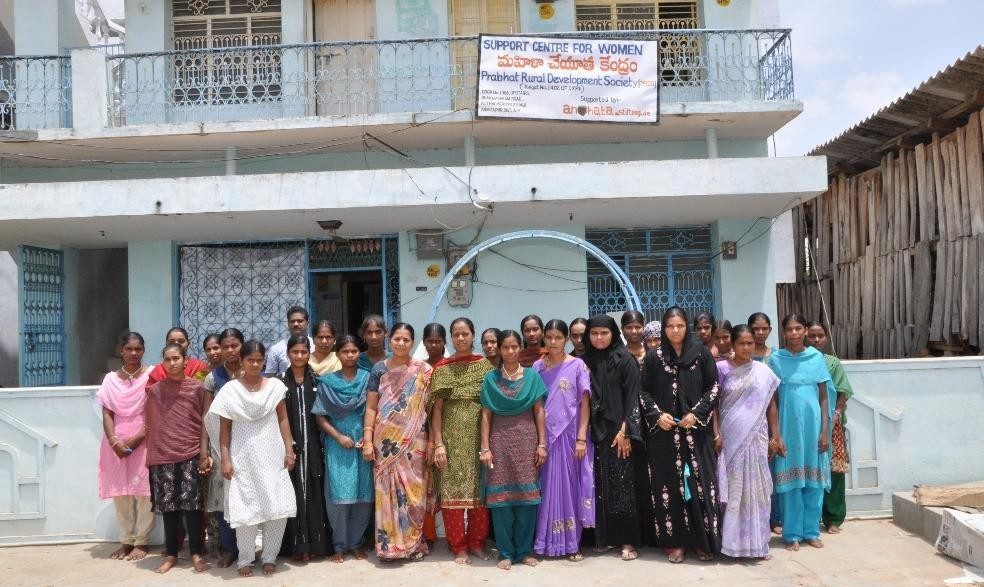 Women of a PRDS women's group outside their meeting hall